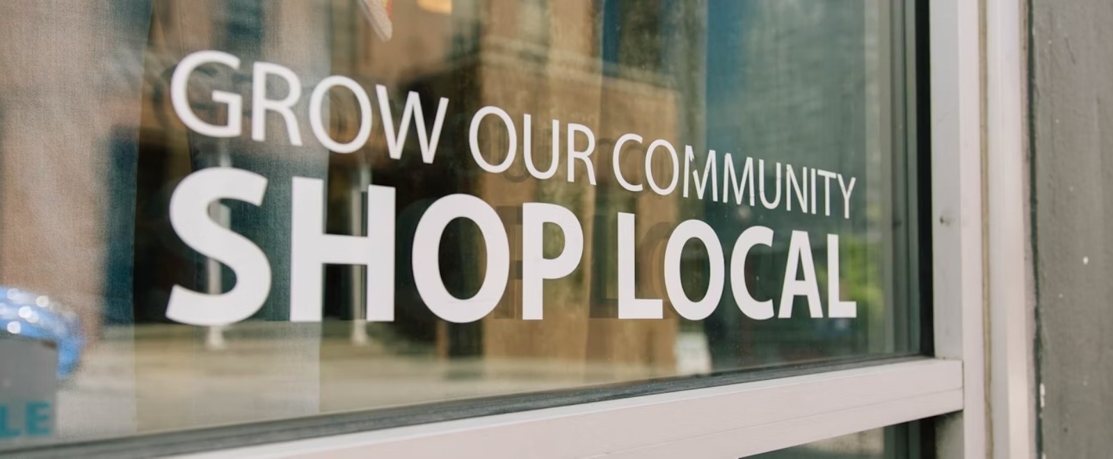 grow our community shop local window lettering